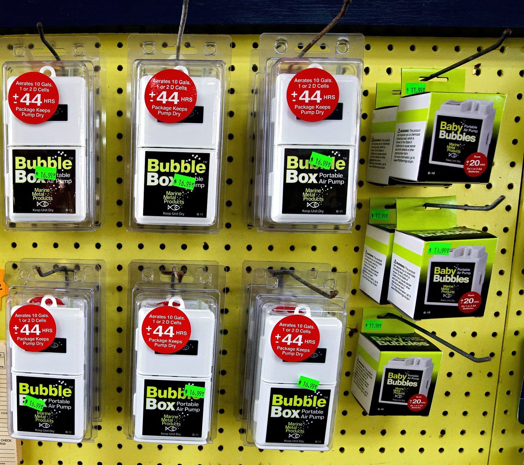 Yellow pegboard of Marine Metal Products Bubble Box and Baby Bubbles portable air pumps for keeping bait alive