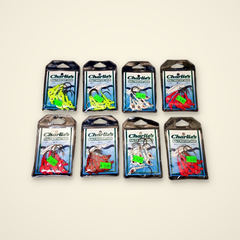 Eight packs of Charlie's Saltwater Jigs in chartreuse, white, red and pink
