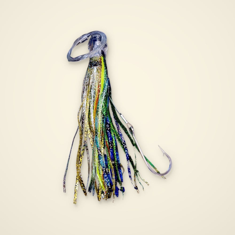 Rigged trolling skirt with gold glitter, chartreuse, blue and green strands, clear head, coiled leader and hook