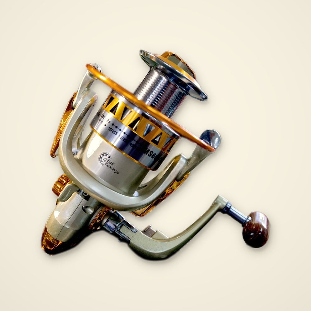 Champagne and gold MS6000 spinning reel with a gold bail and wood-look handle knob on a light background