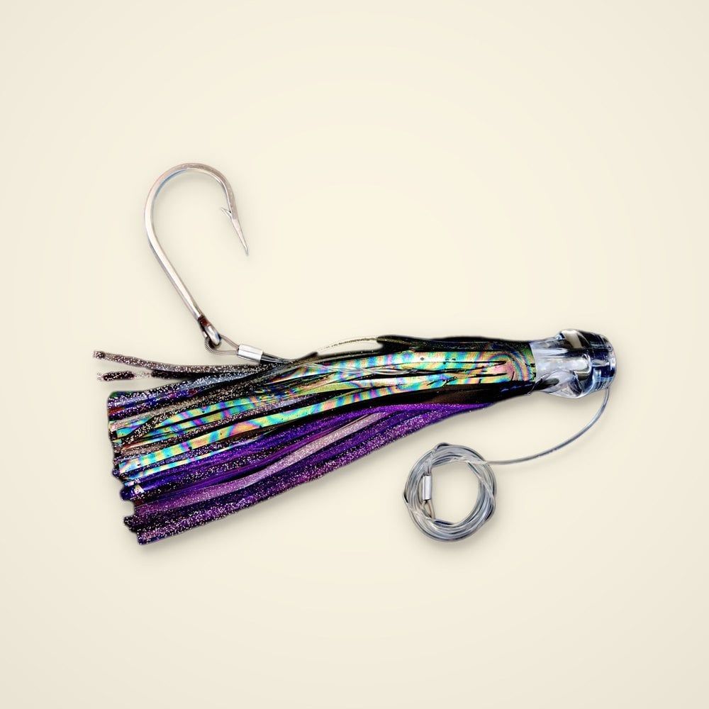 Rigged trolling skirt lure with a clear head, purple glitter and holographic skirt, stainless hook and clear leader coil