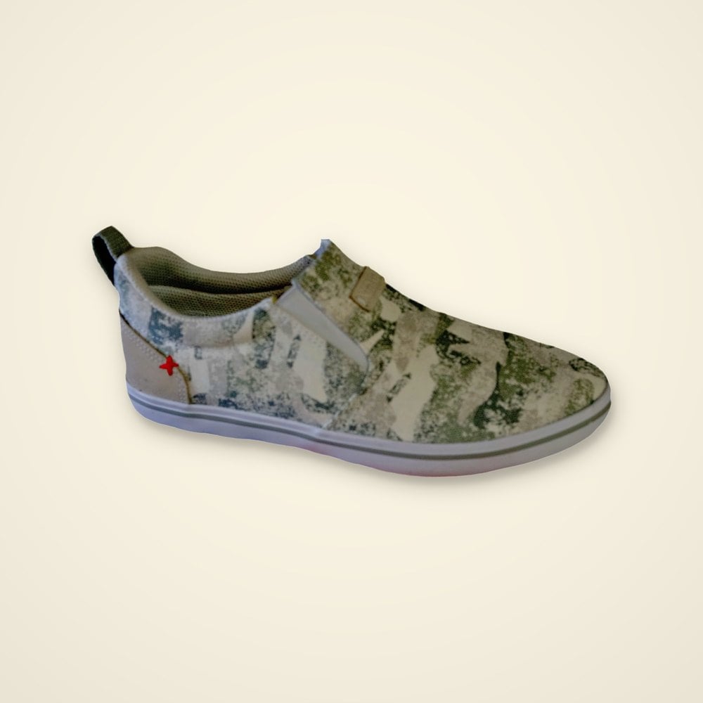 XTRATUF camo print canvas slip-on deck shoe with white sole and red X heel logo on a light background